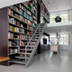 Illustration for article titled This Dream House Was Entirely Built Around a Giant Three-Story-High Bookshelf